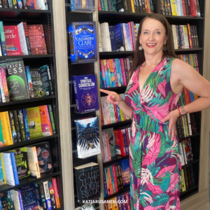 Dr. Katja Rusanen with her book Your Spiritual Curriculum